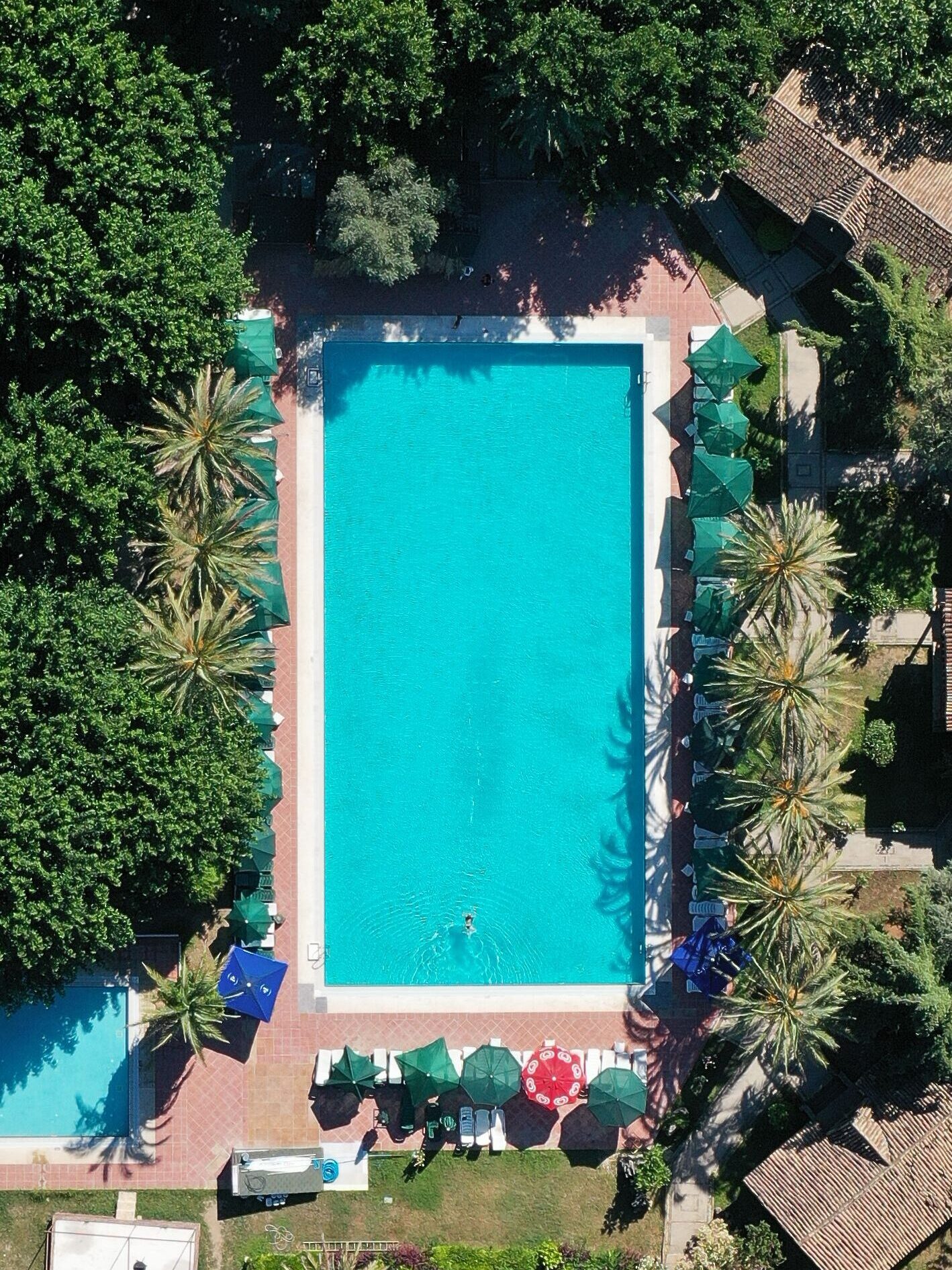 Drone shot capturing a stunning residential area with a large pool in Antalya, Türkiye.